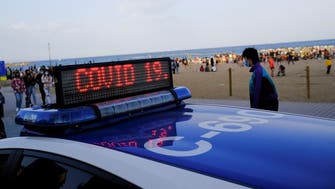 Beach partygoers in Spain’s Barcelona defy COVID-19 measures