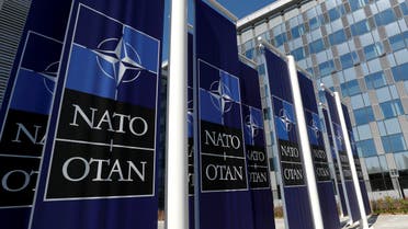 FILE PHOTO: Banners displaying the NATO logo are placed at the entrance of new NATO headquarters during the move to the new building, in Brussels, Belgium. (File photo: Reuters)