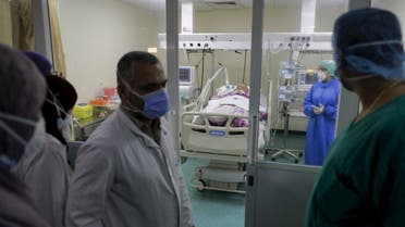 Doctors perform rounds in the intensive care unit of the Rafic Hariri University Hospital in the Lebanese capital Beirut, on November 13, 2020. (AFP)