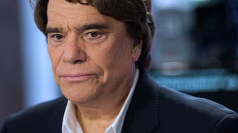 French tycoon Tapie and wife attacked in burglary