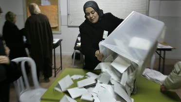 Palestinian elections officials start counting the ballots after voting was declared closed in the West Bank city of Ramallah 25 January 2006. The ruling Fatah faction claimed Wednesday to have fended off an unprecedented challenge to its power from the Islamist Hamas group in the second Palestinian election, whose result promises to have a profound impact on the Middle East peace process. AFP PHOTO/JAMAL ARURI