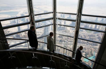 Businessmen walk down the stairs at the 123rd floor of the Burj Khalifa, the tallest building in the world, in Dubai. (File photo: Reuters)