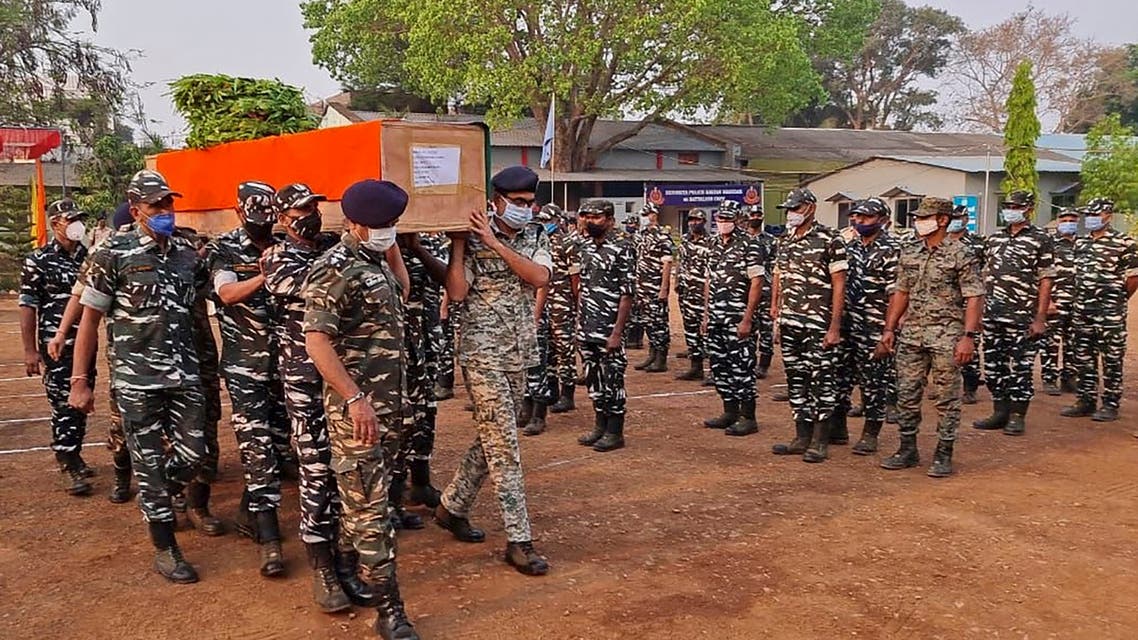 Members of Indian security forces carry the coffin of one of their colleague, who died following a gun battle with Maoist rebels, which left twenty-two members of Indian security forces killed and 30 others wounded, at the Central Reserve Police Force's Jagdalpur camp in Bijapur district of India’s Chhattisgarh state on April 4, 2021. (AFP)