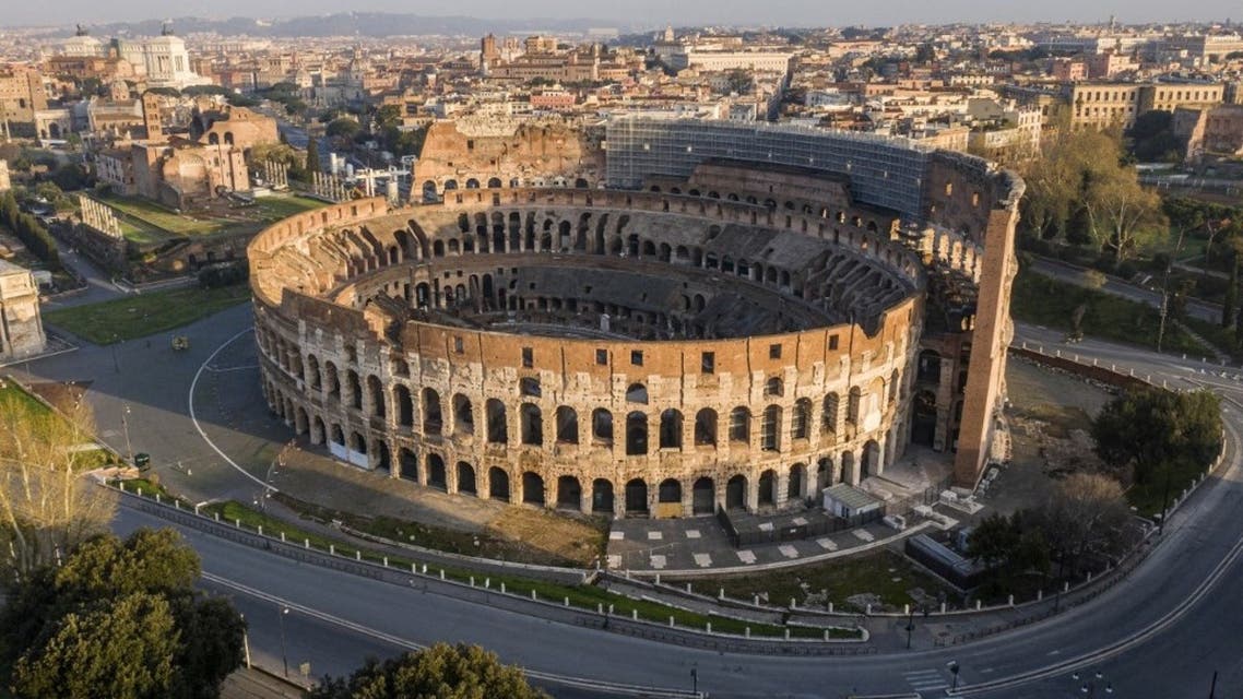 This file photograph taken on March 30, 2020, shows deserted streets and the Colosseum monument in Rome, during the country's lockdown aimed at curbing the spread of the COVID-19 infection. (AFP)