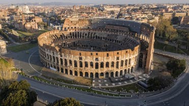 This file photograph taken on March 30, 2020, shows deserted streets and the Colosseum monument in Rome, during the country's lockdown aimed at curbing the spread of the COVID-19 infection. (AFP)