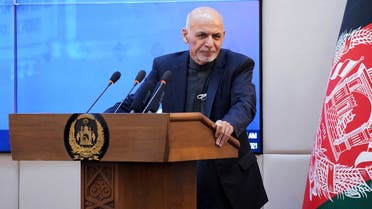 This handout photograph taken on February 23, 2021 and released by the Press Office of President of Afghanistan shows Afghan President Ashraf Ghani speaking during a ceremony at the Presidential Palace in Kabul, as Afghanistan launched a Covid-19 vaccination campaign.