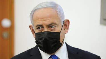 Israeli Prime Minister Benjamin Netanyahu, wearing a face mask, looks as his corruption trial resumes, at Jerusalem's District Court April 5, 2021. (Reuters)