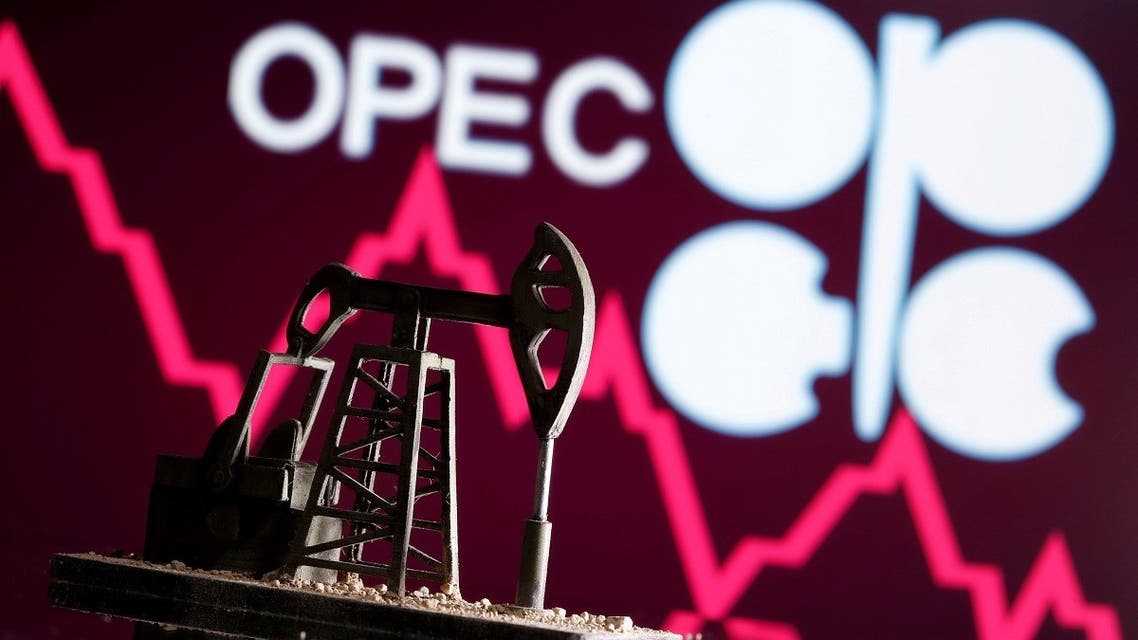 A 3D printed oil pump jack is seen in front of displayed stock graph and Opec logo in this illustration picture, on April 14, 2020. (Reuters)