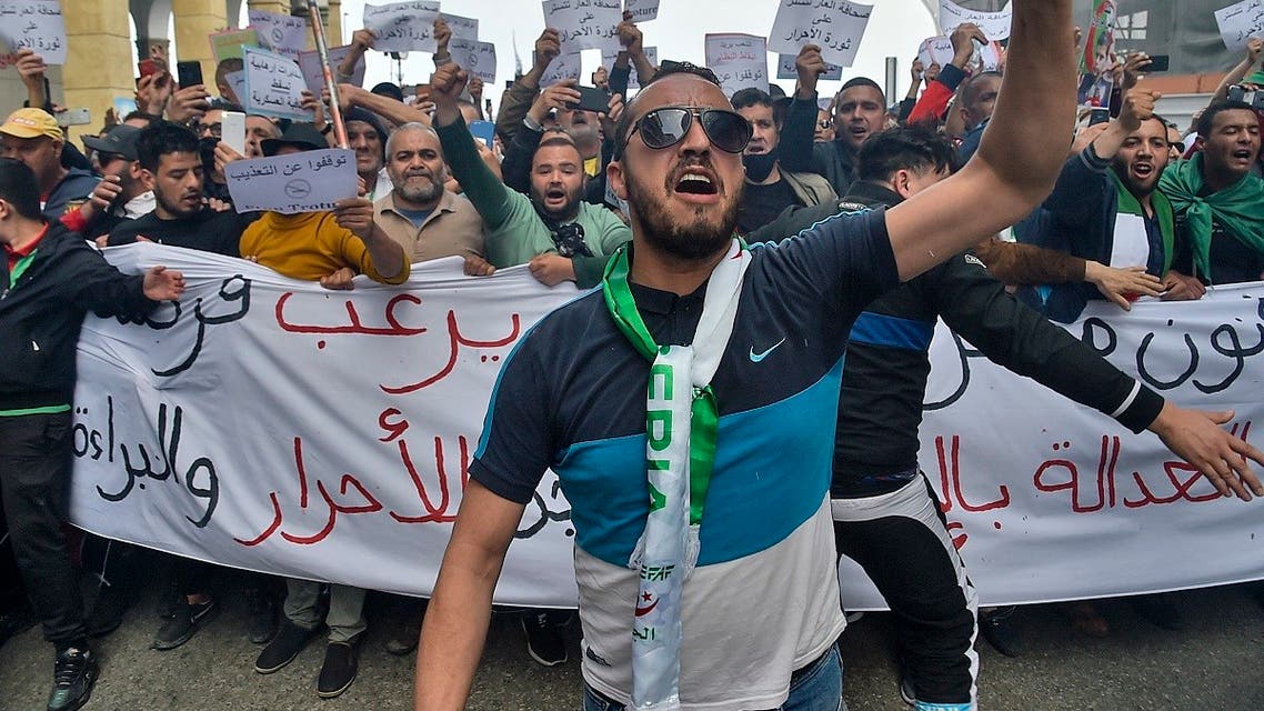 Algerians shout slogans during an anti-government demonstration in the capital Algiers on April 2, 2021. (Ryad Kramdi/AFP)