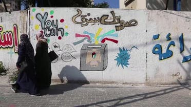 Writing on a wall calling for young people to vote in the coming Palestinian elections, in Gaza City, Gaza, April 5, 2021. (Reuters)