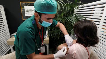 A resident receives a commercial dose of Russia's Sputnik V coronavirus disease (COVID-19) vaccine, at a private hospital in Karachi, Pakistan. (Reuters)