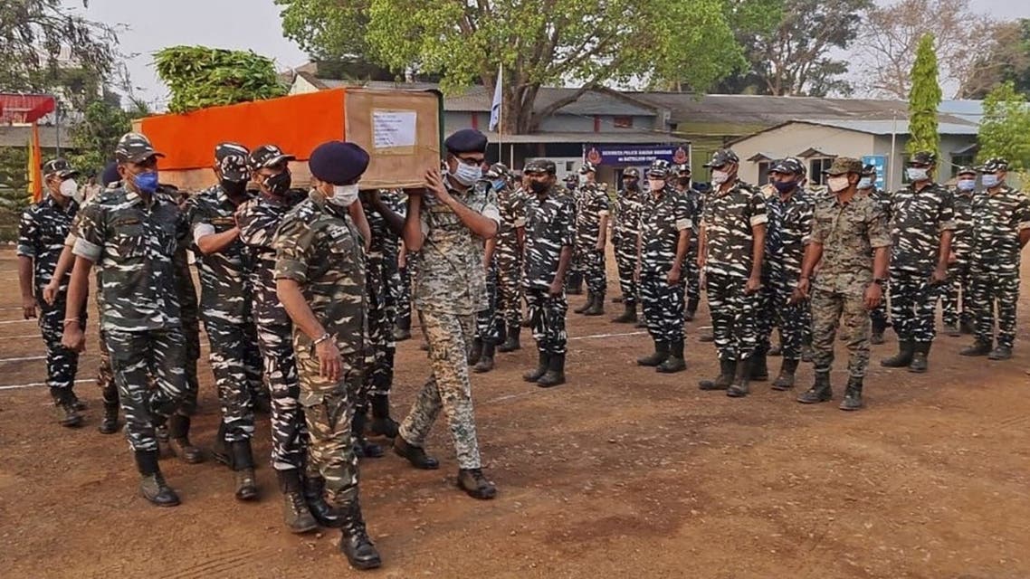 Members of Indian security forces carry the coffin of one of their colleague, who died following a gun battle with Maoist rebels, which left twenty-two members of Indian security forces killed and 30 others wounded, at the Central Reserve Police Force's Jagdalpur camp in Bijapur district of India’s Chhattisgarh state on April 4, 2021. (AFP)