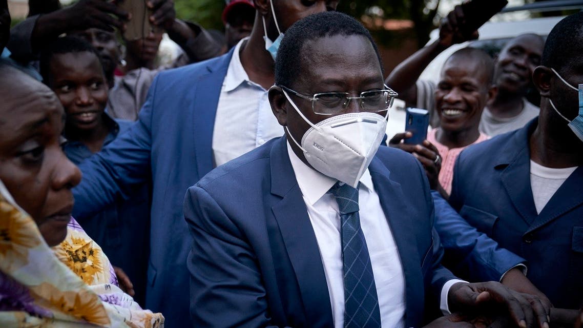 Malian politician Soumaila Cisse greets supporters as he arrives at his home in Bamako, on October 9, 2020, a day after his release. (Michele Cattani/AFP)