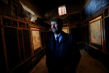 Dario Franceschini, Italian Culture Minister, looks on in one of three restored domus (ancient houses) that has reopened to the public at the archaeological site of Pompeii, Italy, on February 18, 2020. (Reuters)