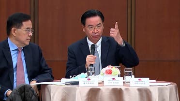 Taiwanese Foreign Minister Joseph Wu, right, speaks during a briefing Wednesday, April 7, 2021, in Taipei, Taiwan. Wu said that China's attempts at conciliation and military intimidation are sending mixed signals to people on the island China claims as its own territory to be won over peacefully or by force. (AP) 