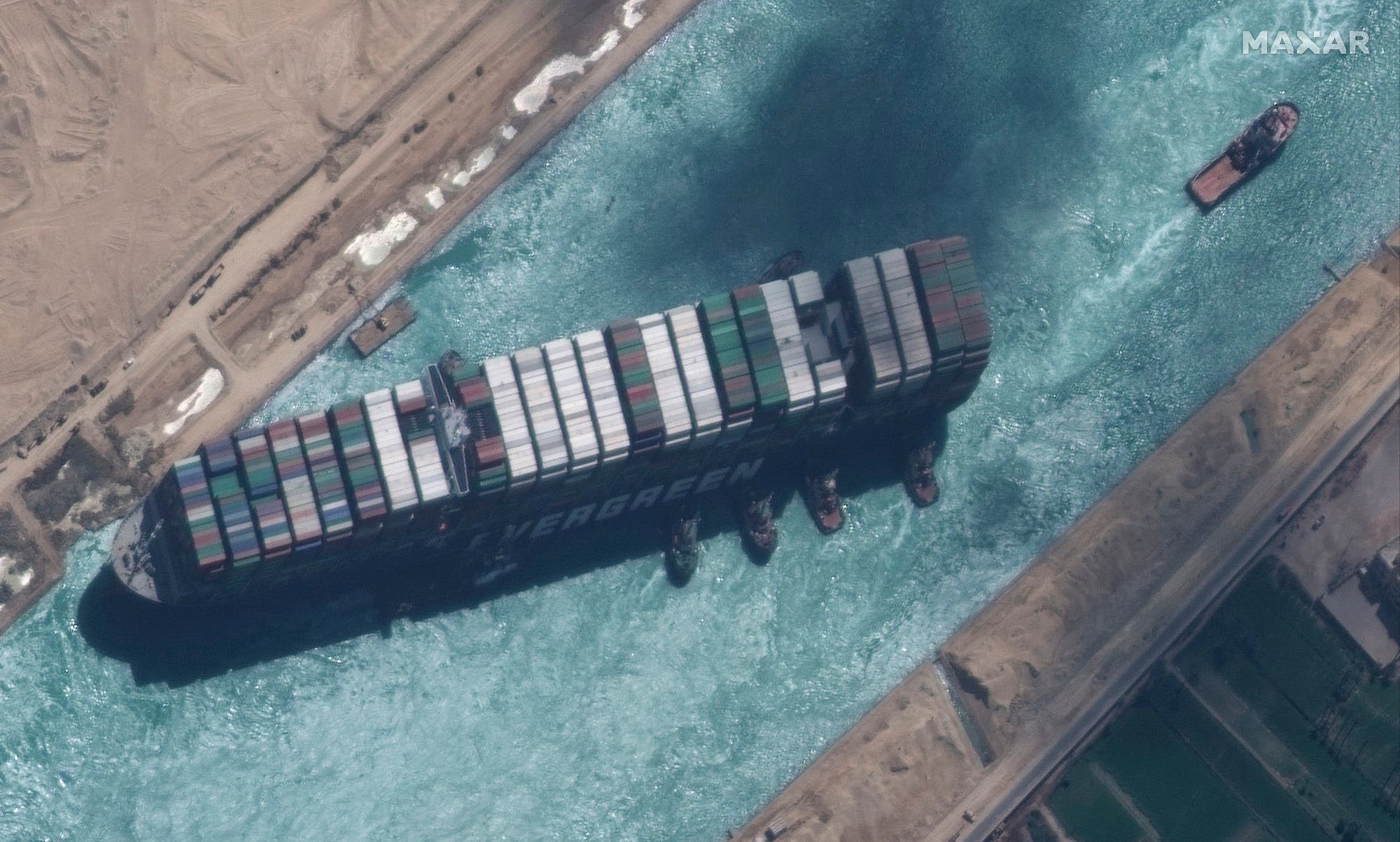 Satellite photo of the Evergreen ship and tugs in the Suez Canal on March 29, 2021