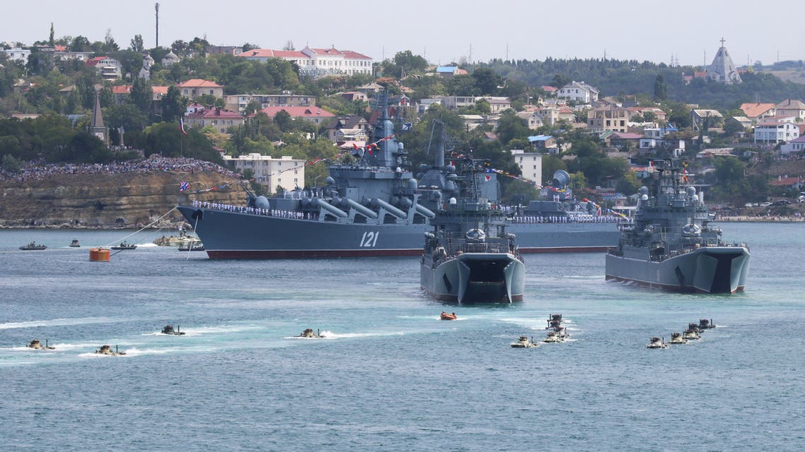 Russian armoured personnel carriers submerge from amphibious assault ships during the Navy Day parade in the Black Sea port of Sevastopol, Crimea July 26, 2020. REUTERS/Alexey Pavlishak