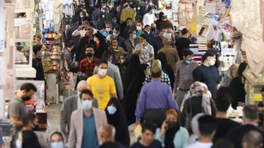 Iranian people walk in Tehran Bazaar, in Tehran, Iran April 6, 2021. (West Asia News Agency via Reuters)