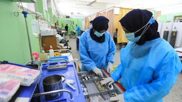 Palestinian medics work at the COVID-19 intensive care unit of al-Shifa Hospital in Gaza City on April 7, 2021.