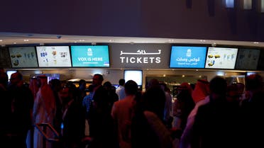 Saudi people gather at the ticket counter during the opening of a cinema at Riyadh Park mall in Riyadh, Saudi Arabia April 30, 2018. REUTERS/Faisal Al Nasser