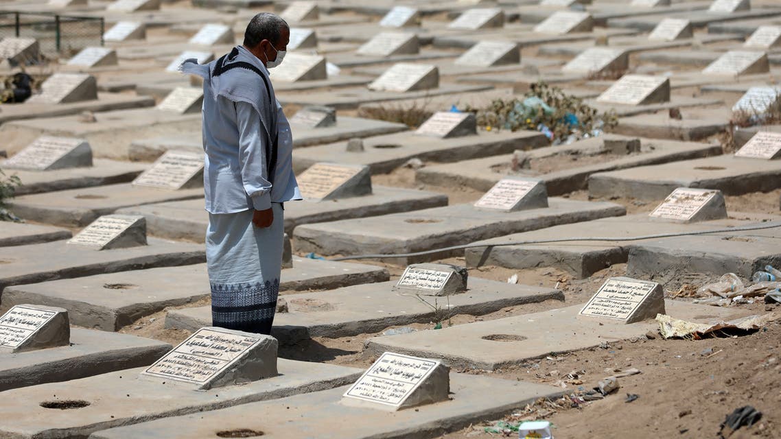 A Yemeni man visits the graves of loved ones close to a specific plot allocated to Covid-19 victims at a cemetery in Yemen's third city of Taez on April 3, 2021, amid a surge in cases of coronavirus that the war-torn country is badly equipped to combat. Between the mountain ranges of Taez, dozens of fresh graves are being hastily dug in Yemen's third city to deal with a spike in deaths from Covid-linked complications.