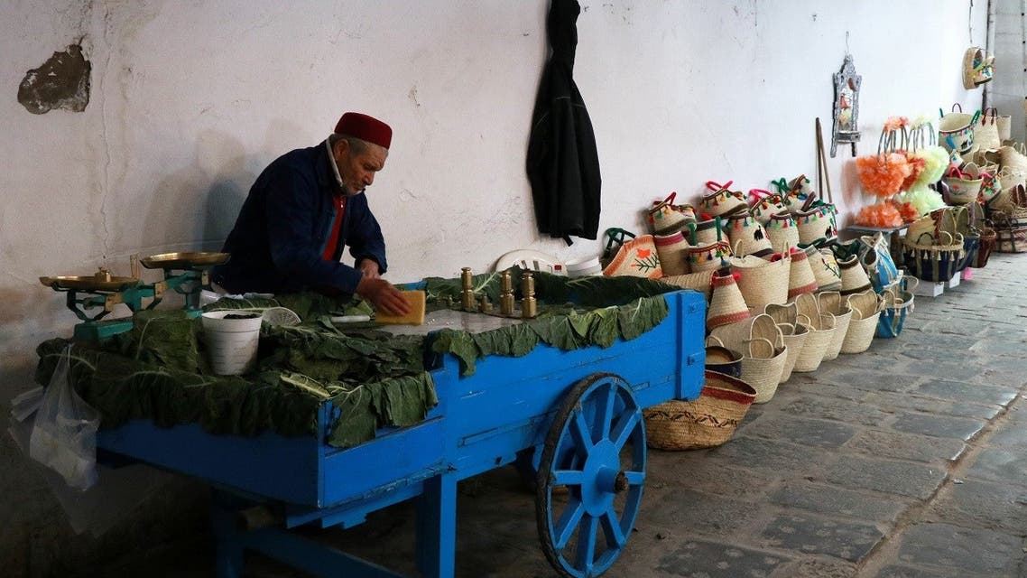 A street vendor stands near his cart in the Medina, in the old city of Tunis, amid the coronavirus, Tunisia, on March 24, 2021. (Reuters)