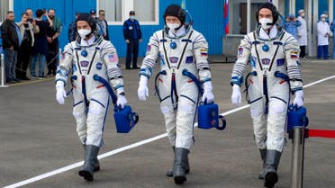From left: US astronaut Mark Vande Hei, Russian cosmonauts Oleg Novitsky and Pyotr Dubrov, members of the main crew to the International Space Station (ISS), walk prior to the launch at the Russian leased Baikonur cosmodrome, Kazakhstan, on April 9, 2021. (AP)