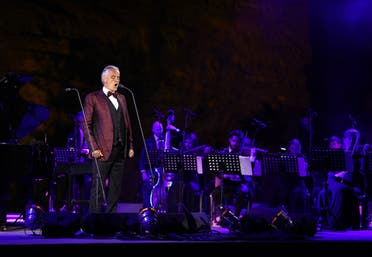 Italian tenor and opera singer Andrea Bocelli singing during a concert at the Hegra World Heritage Site in the northwestern Saudi city of al-Ula on April 8, 2021. (AFP)