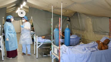 A man lies on a bed at a coronavirus disease (COVID-19) quarantine center in Aden, Yemen March 27, 2021. Picture taken March 27, 2021. REUTERS/Fawaz Salman