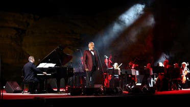 Italian tenor and opera singer Andrea Bocelli singing during a concert at the Hegra World Heritage Site in the northwestern Saudi city of al-Ula on April 8, 2021. (AFP)