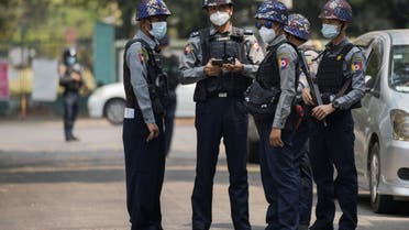 Police officers are seen outside Kamayut township court where the hearing of a group of journalists who were detained during anti-coup protests is scheduled, including that of Associated Press journalist Thein Zaw, in Yangon March 12, 2021. (File photo: Reuters)