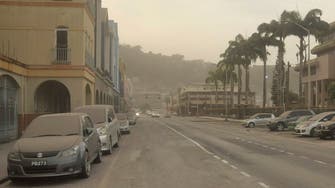 St Vincent’s Caribbean residents wake to ash-covered streets, rumbling volcano