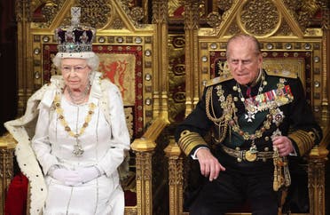  Queen Elizabeth waits to read the Queen's Speech to lawmakers in the House of Lords, next to Prince Philip, during the State Opening of Parliament in central London, on May 9, 2012. (Reuters)