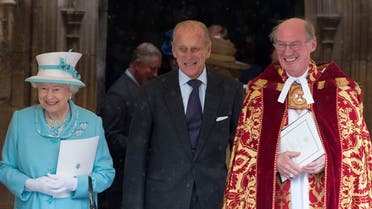 Britain's Queen Elizabeth (L) and her husband Prince Philip (C) talk with the Dean of Windsor, David Conner, after a Church Service to mark Prince Philip's 90th birthday, in Windsor, west of London June 12, 2011. (Reuters)