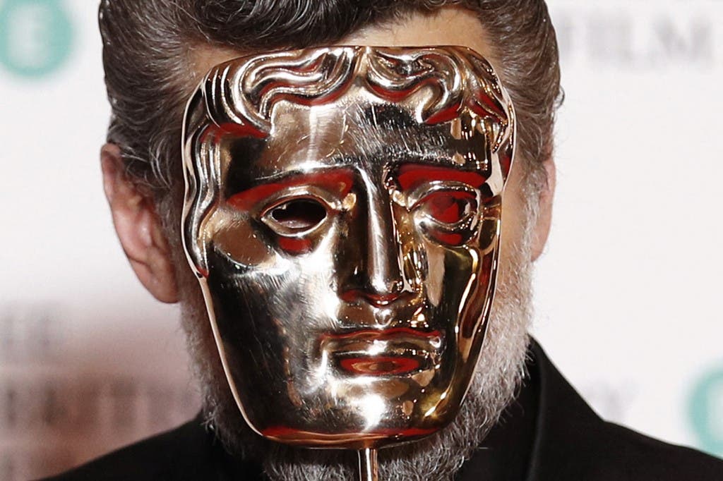 British actor Andy Serkis poses with the award for Outstanding Contribution to British Film at the BAFTA British Academy Film Awards at the Royal Albert Hall in London on February 2, 2020. (AFP)