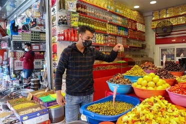 A Palestinian man sells pickles at a market, ahead of the holy fasting month of Ramadan, in Gaza City. (Reuters)