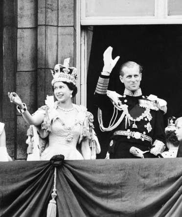Britain’s Queen Elizabeth II (L) accompanied by Britain’s Prince Philip, Duke of Edinburgh (R) waves to the crowd, on June 2, 1953 after being crowned at Westminter Abbey in London. (AFP)