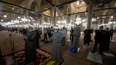 People pray at Al-Hussein mosque as it is being prepared for prayers during the holy month of Ramadan, following the outbreak of the coronavirus disease (COVID-19), in Cairo, Egypt, April 7, 2021. (Reuters)