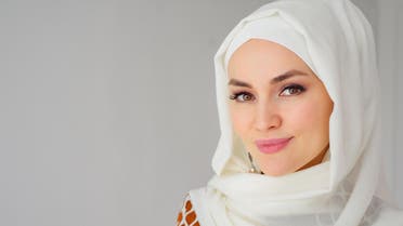 Portrait of muslim arabian woman wearing hijab, looking at camera stock photo