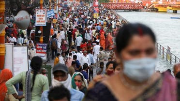 Devotees are seen on the banks of the Ganges river during Kumbh Mela, or the Pitcher Festival, amidst the spread of the coronavirus disease (COVID-19), in Haridwar, India, April 12, 2021. (Reuters)