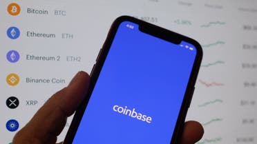 This illustration photo shows the Coinbase logo on a smartphone in Los Angeles on April 13, 2021. (AFP)
