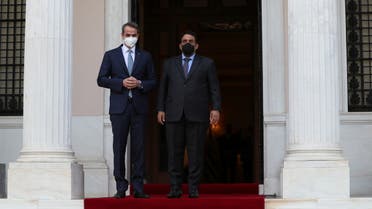 Greek Prime Minister Kyriakos Mitsotakis welcomes the head of the Presidential Council of Libya Mohamed al-Menfi at the Maximos Mansion, in Athens, Greece, April 14, 2021. REUTERS/Costas Baltas