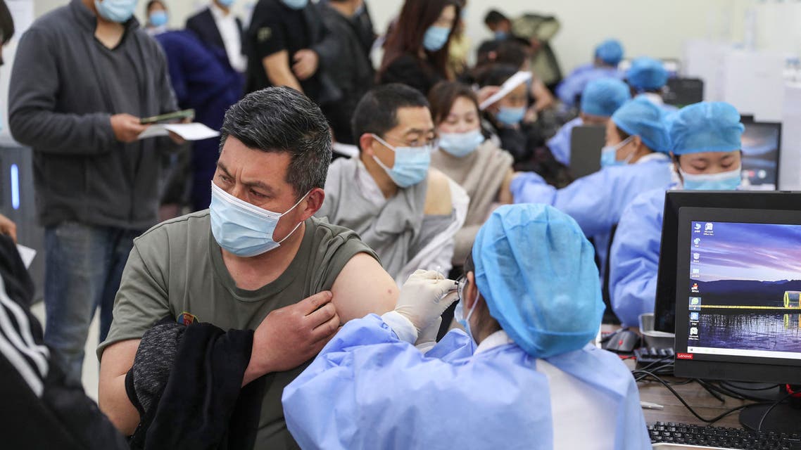 sidents queue to receive the Sinovac Covid-19 coronavirus vaccine in Lianyungang in China's eastern Jiangsu province on April 1, 2021.