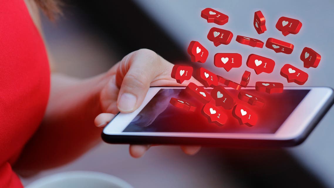 Women holding mobile phone with social media notification icon stock photo