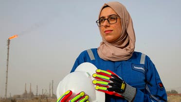 Zainab Amjad, a petrochemical engineer, poses for a photo near an oil field outside Basra, Iraq, Monday, Feb. 18, 2021. Amjad is among just a handful of women who have eschewed the dreary office jobs typically handed to female petrochemical engineers in Iraq. Instead, they chose to become trailblazers in the country's oil industry, taking up the grueling work of drilling. (File photo: AP)
