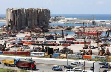 Vehicles drive near the grain silo that was damaged during Beirut port explosion, in Beirut, April 9, 2021. (Reuters)