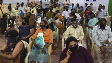 People wait to receive a dose of the Covishield, AstraZeneca-Oxford's Covid-19 coronavirus vaccine in Mumbai on April 10, 2021. (AFP)