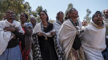Mainly women mourn the victims of a massacre allegedly perpetrated by Eritrean Soldiers in the village of Dengolat, North of Mekele, the capital of Tigray on February 26, 2021. (AFP)