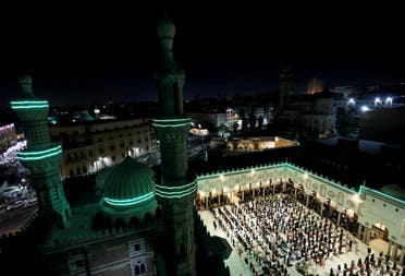 Muslims perform evening Tarawih prayers inside Al-Azhar Mosque on the holy fasting month of Ramadan, amid the coronavirus disease (COVID-19) pandemic in the old Islamic area of Cairo, Egypt, April 13, 2021. (Reuters)