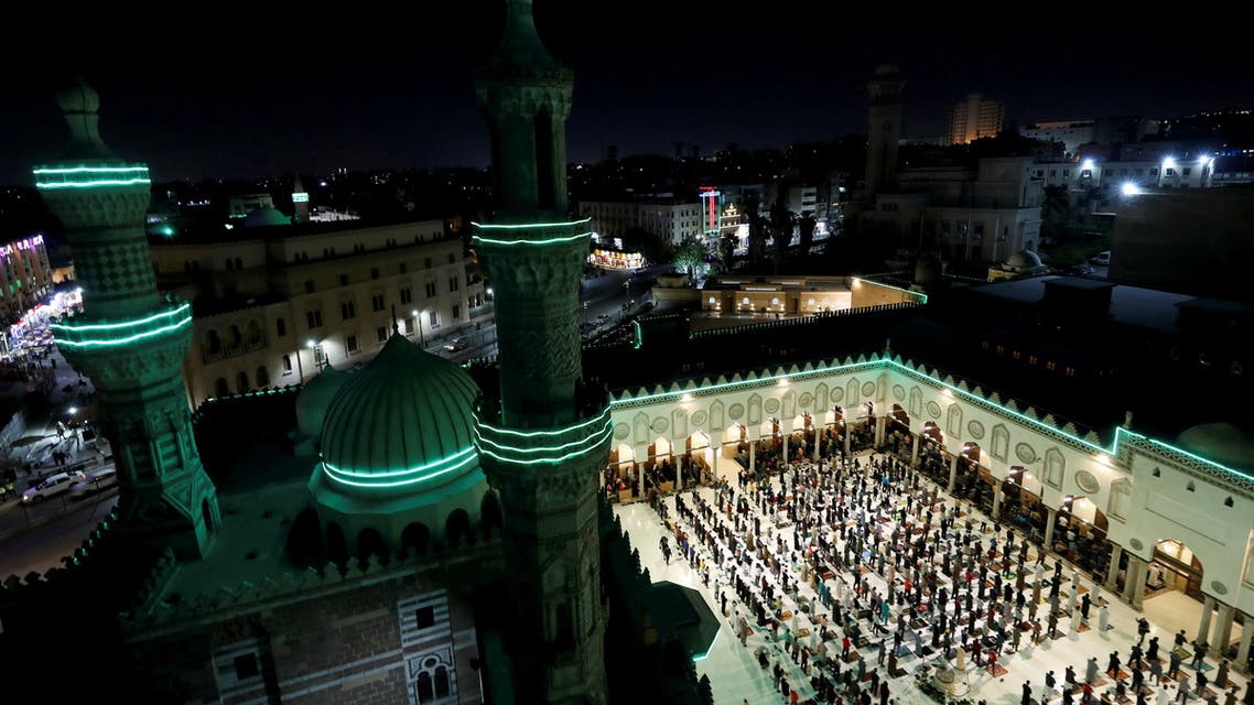 Muslims perform evening Tarawih prayers inside Al-Azhar Mosque on the holy fasting month of Ramadan, amid the coronavirus disease (COVID-19) pandemic in the old Islamic area of Cairo, Egypt, April 13, 2021. (Reuters)